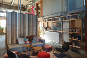  Umnutzung der bestehenden erdgeschossigen Lagerhalle in eine Co-Working-Landschaft mit Galerien unter Verwendung gefundener Bauteile und dem Einsatz nachwachsender Materialien in Bauweisen wie Wänden aus Hanfkalk.  